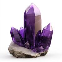 Purple crystal cluster on stone photo