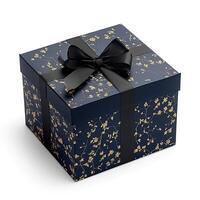 Elegant gift box with a dark navy blue background, featuring delicate gold floral patterns and a black ribbon photo