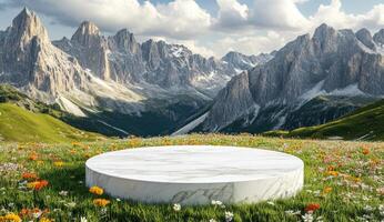 Empty white marble podium in a flower-filled alpine meadow, with majestic mountain backdrop photo