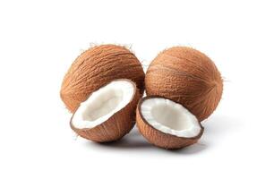 Fresh coconuts, whole and halved, on white background photo