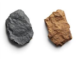 Two contrasting rocks, dark grey and light brown, on a white background photo