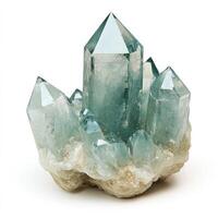 Cluster of translucent teal quartz crystals atop a light beige base photo
