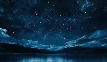 Starry night over a tranquil lake photo