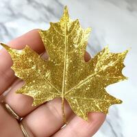 Gold glitter maple leaf photo