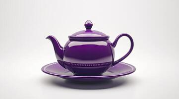 Deep purple teapot on a matching saucer photo