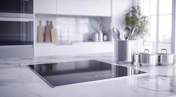 Sleek modern kitchen countertop with a sleek cooktop and stainless steel utensil caddy photo