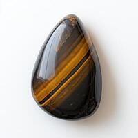 Polished teardrop-shaped tiger's eye gemstone photo