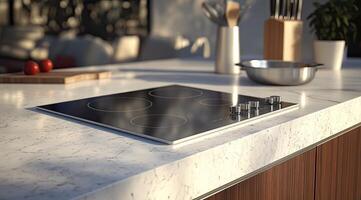 Sleek cooktop on a marble countertop photo