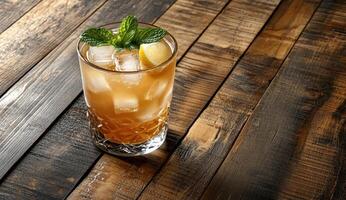 Refreshing iced cocktail garnished with mint and lemon photo
