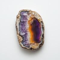 A slice of agate, showcasing a vibrant blend of purple and orange photo