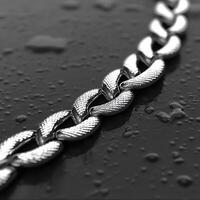 Close-Up of Polished Steel Chain Links on Wet Dark Surface photo