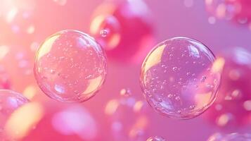 Close-Up of Floating Transparent Bubbles in a Dreamy Pink Background photo