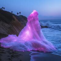 Illuminated Purple Wave Forming on a Serene Beach at Blue Hour photo