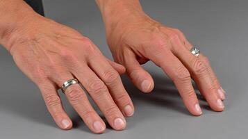 A person with two rings on their hands photo