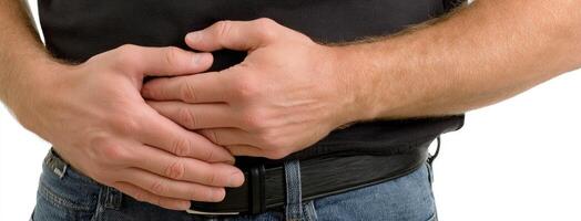 A man is holding his hands together in his jeans photo