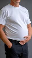 A man with his stomach in his hands photo