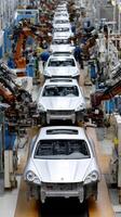 A factory with cars on the assembly line photo