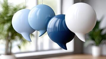 Three blue and white speech bubbles hanging from a ceiling photo