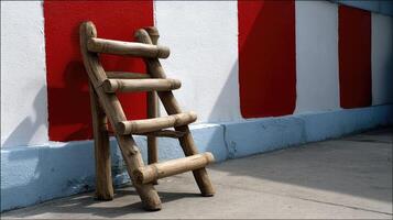 A ladder leaning against a wall photo