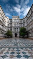 The courtyard of a large building with a tiled floor photo