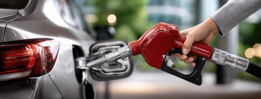 A person is filling up their car with gas photo