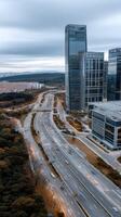 Aerial view of modern city with highway and tall buildings photo