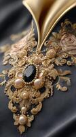 A black and gold embroidered jacket with pearls and gold beads photo