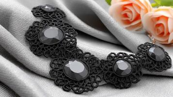 A black lace necklace with black stones photo