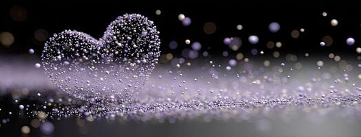 A heart shaped object made of glitter on a black background photo