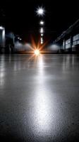 An empty warehouse with a bright light shining through the windows photo