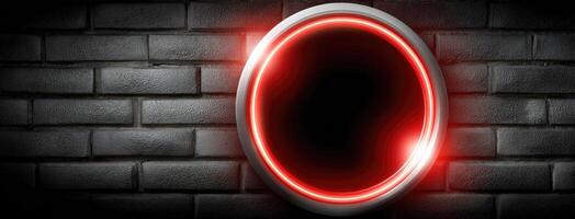A red and black circular light is on a brick wall photo