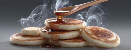 A stack of pancakes with syrup and butter photo