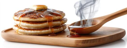 A stack of pancakes with syrup and syrup on top photo