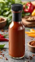 A bottle of hot sauce with spices and herbs photo