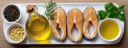 Salmon, beans, olives and other ingredients on a white plate photo