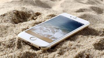An iphone laying in the sand on a beach photo
