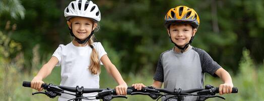 Two children wearing helmets on bicycles photo