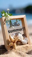 A picture frame with a starfish and shells on a beach photo