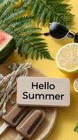 Hello summer sign on wooden plate with watermelon, lemon, lime, watermelon, watermelon photo