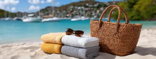 Towels and sunglasses on the beach with boats in the background photo