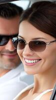 A woman wearing sunglasses and a man wearing sunglasses photo