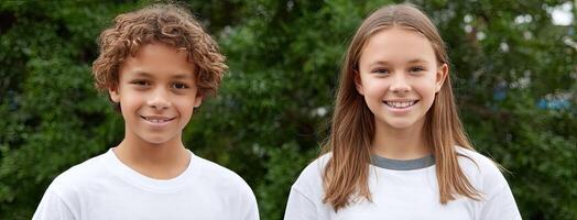 Two young children smiling at the camera photo