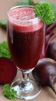 Beet juice in a glass with fresh beets photo