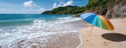 A colorful umbrella on the beach near the ocean photo