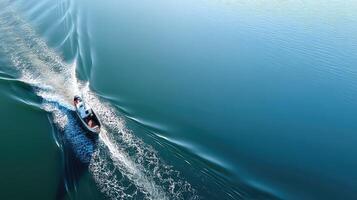 A boat traveling on a body of water photo
