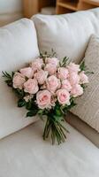Pink roses on a couch photo