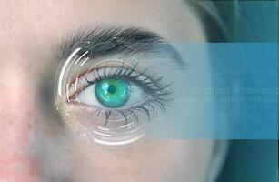 Close-up of a human eye with digital overlays showing biometric data and futuristic elements in a technology setting photo