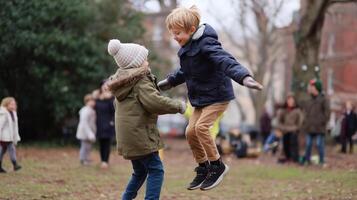 Children enjoy jumping together in a playground during a chilly afternoon in winter photo