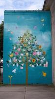 Vibrant mural depicting a flourishing tree adorned with flowers and butterflies in an urban setting photo