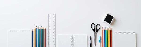 Creative workspace with colorful stationery, notebooks, and tools for artistic projects and organization photo